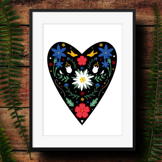 illustration of alpine flowers including edelweiss, geranium and gentium in a heart on an art print thats framed