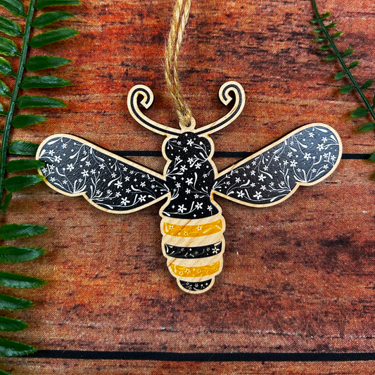 Folk art modern floral illustration of a bee on a wooden decoration