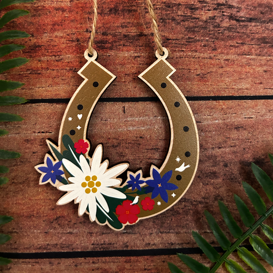 Decorative horseshoe with edelweiss and alpine floral design