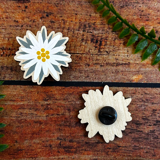 swiss edelweiss illustration on wooden pin badge souvenir of switzerland