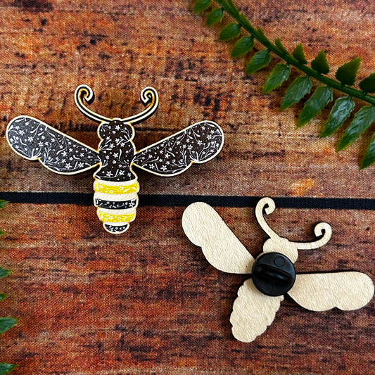 Floral illustrated bee wooden pin badge