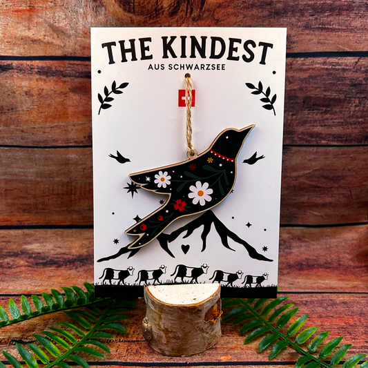 Decorative folk art bird illustration on wooden decoration on backing card