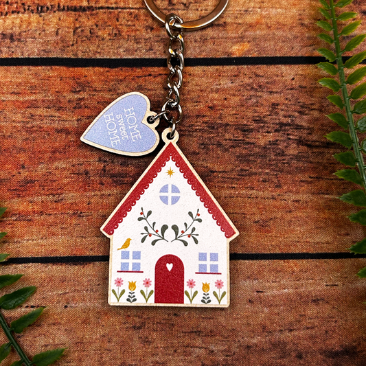 floral home keyring with blue heart that says home sweet home