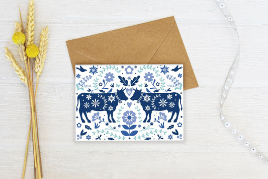 Swiss Blue Floral Cows Greeting Card