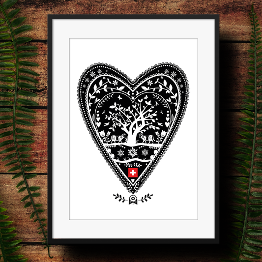 Framed art print showing a swiss style papercut design in a heart. 