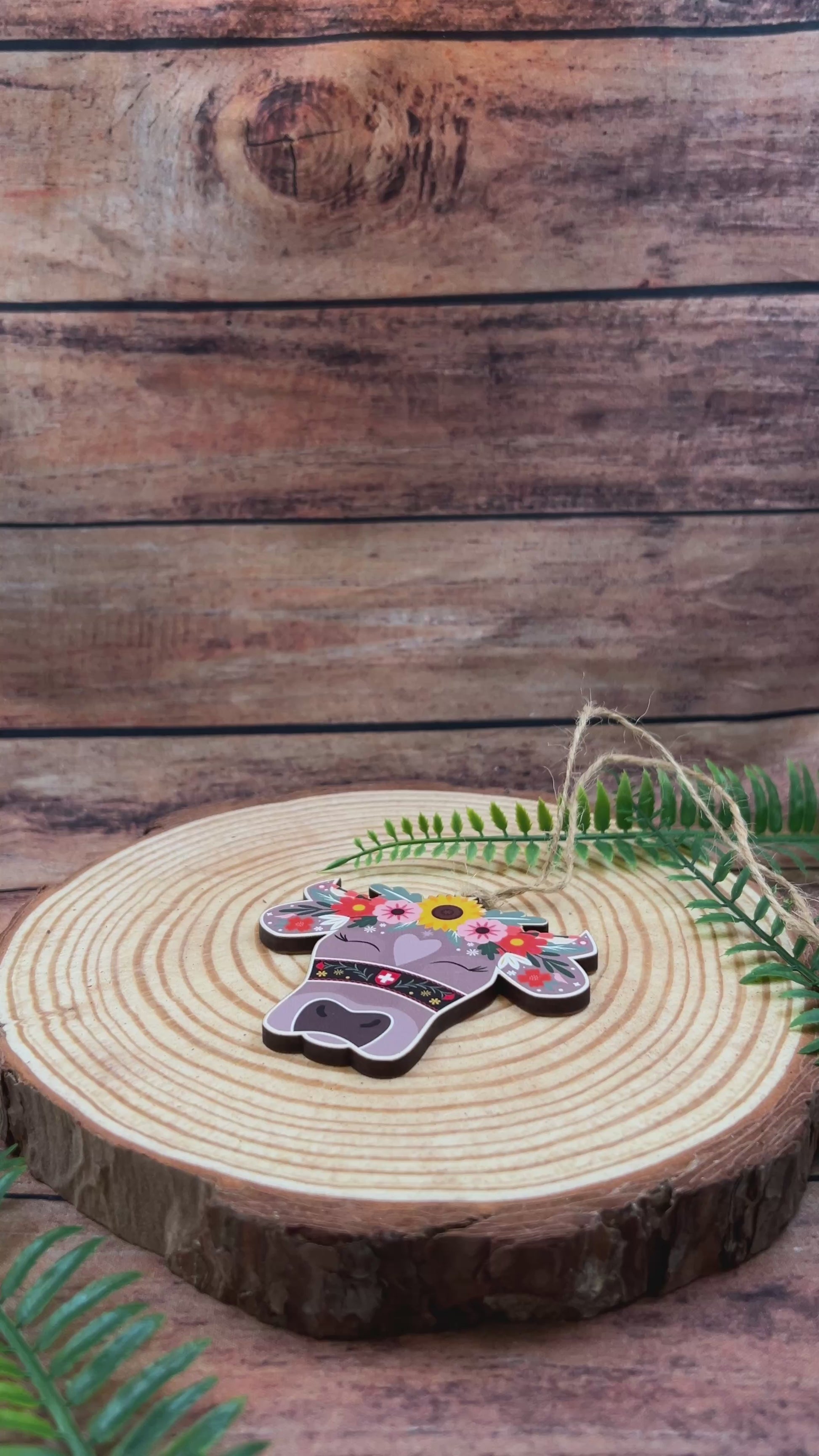 video of Swiss Cow Floral Wooden Souvenir Decoration